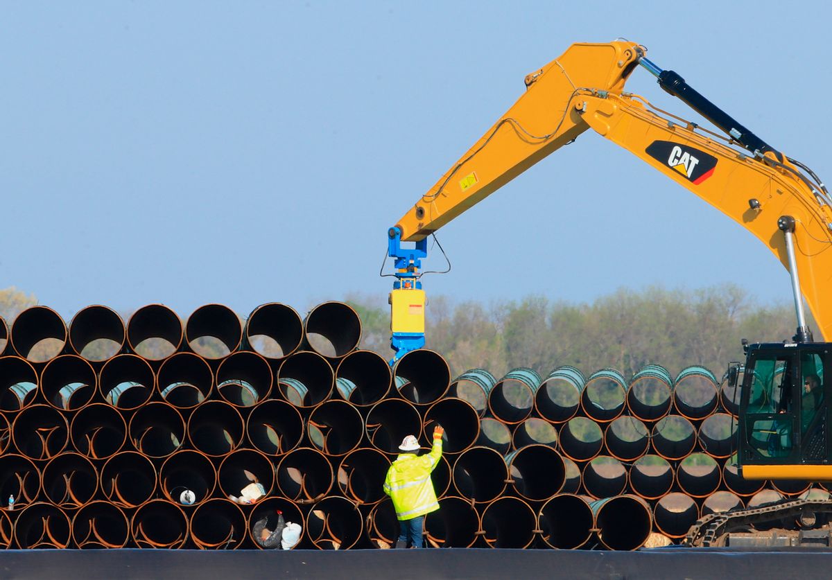 FILE - In this May 9, 2015 file photo, pipes for the proposed Dakota Access oil pipeline that will stretch from the Bakken oil fields in North Dakota to Illinois are stacked at a staging area in Worthing, S.D. Construction on the pipeline is now underway in North Dakota, South Dakota and Illinois, three of the four states that will carry the oil from western North Dakota. The pipeline also will cross Iowa, but regulators there have declined to act quickly on a request to allow Texas-based Energy Transfer Partners to begin construction in that state. (AP Photo/Nati Harnik, File) (AP)
