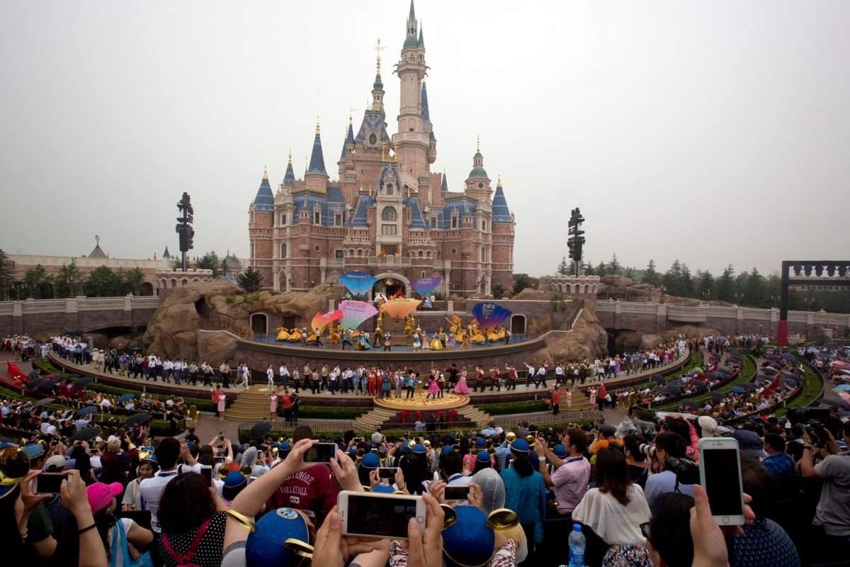Performers take to the stage during the opening ceremony for the Disney Resort in Shanghai, China, Thursday, June 16, 2016. Walt Disney Co. opened its first theme park in mainland China on Thursday at a ceremony that mixed speeches by Communist Party officials, a Chinese children's choir and actors dressed as Sleeping Beauty and other Disney characters. (AP Photo/Ng Han Guan) (AP)