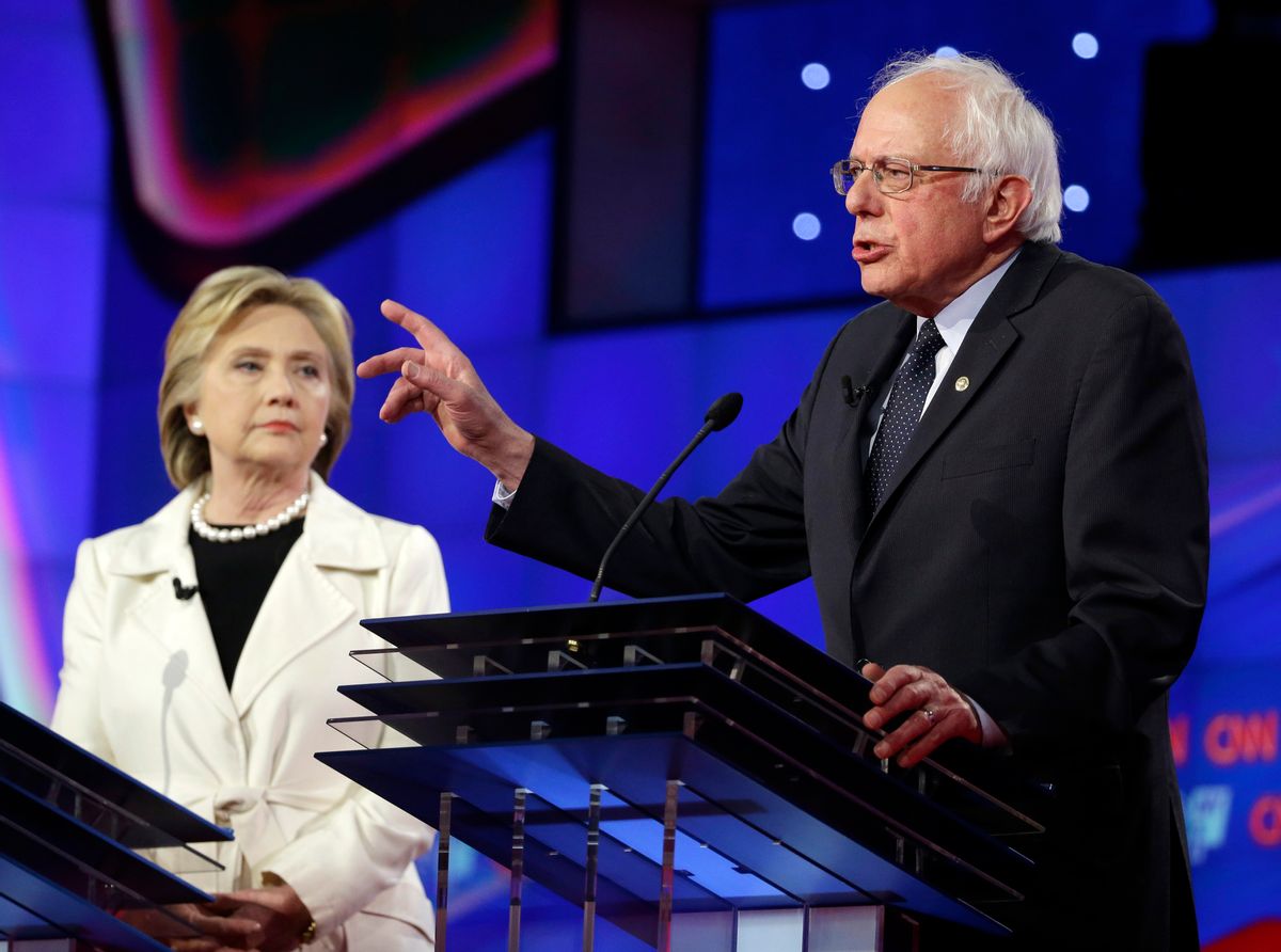 FILE -In this April 14, 2016 file photo, Democratic presidential candidate Sen. Bernie Sanders, I-V.t, right, speaks as Hillary Clinton listens during the CNN Democratic Presidential Primary Debate at the Brooklyn Navy Yard in New York. (AP Photo/Seth Wenig, File) (AP)