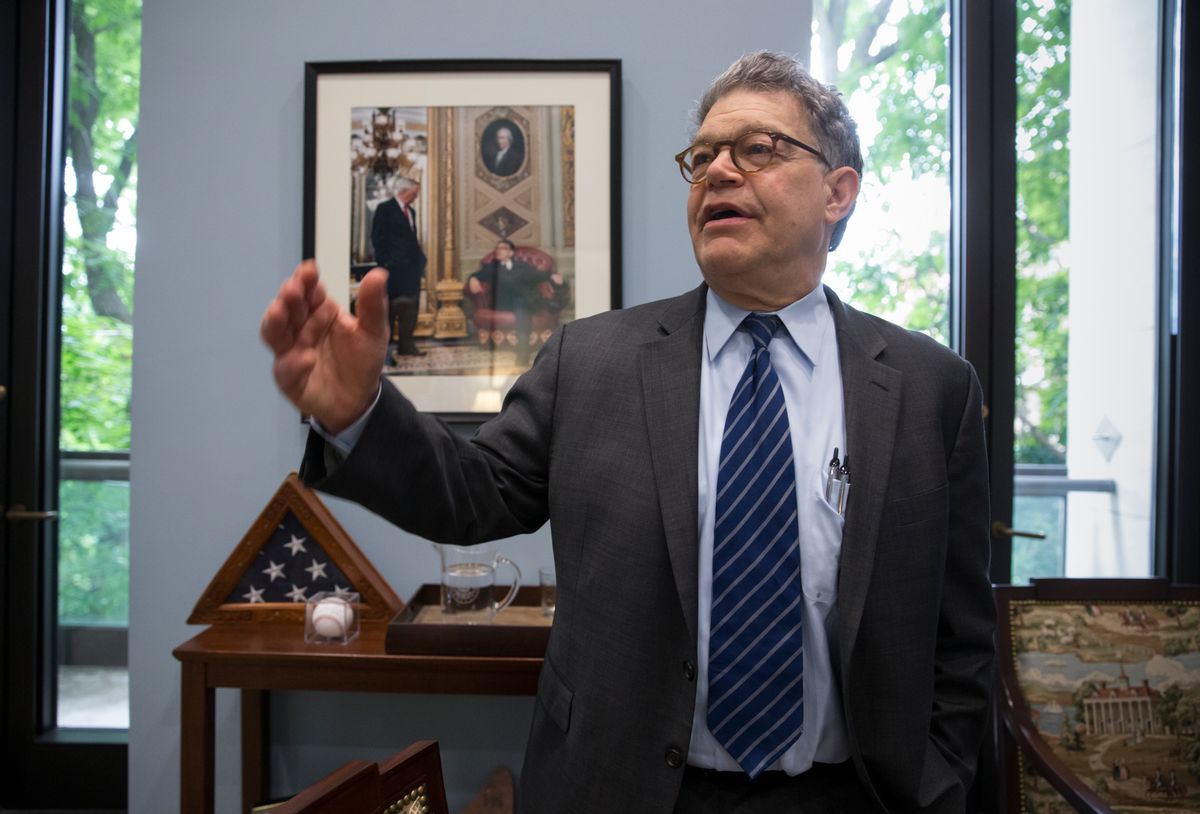 Sen. Al Franken, D-Minn., reminisces about his start in politics as he stands in front of a photo of himself with fellow Minnesotan Walter Mondale who served as a senator and vice-president, on Capitol Hill in Washington, Wednesday, June 15, 2016. (AP)