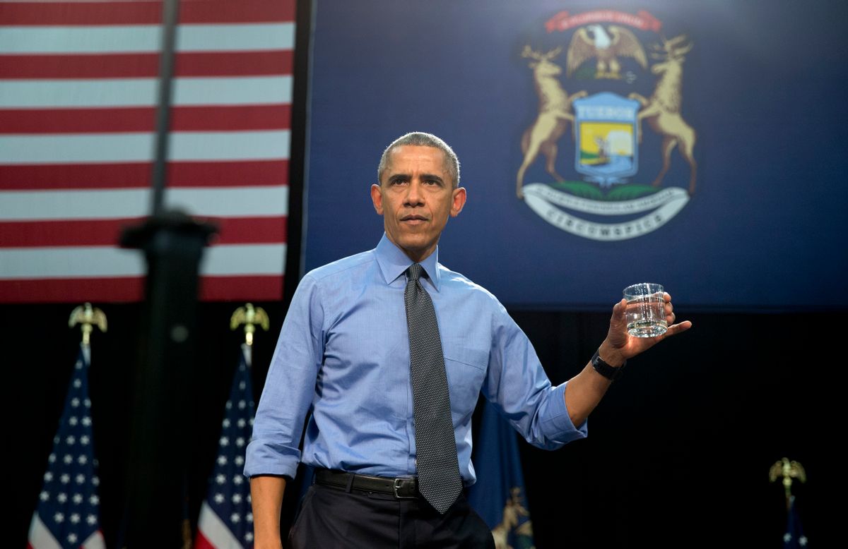 FILE - In this May 4, 2016 file photo, President Barack Obama holds up a glass of water he will drink from, after speaking at Flint Northwestern High School about the ongoing water crisis, in Flint, Mich. Flints lead-contaminated water crisis has affected all of the citys nearly 100,000 residents, but some grapple with an extra challenge: A language barrier. Obama, who declared a state of emergency in the city in mid-January and ordered federal aid to supplement the state and local response, visited Flint in May. (AP Photo/Carolyn Kaster, File) (AP)