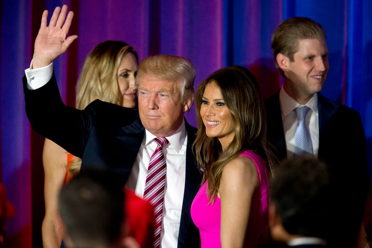 Republican presidential candidate Donald Trump waves at supporters as he leaves the stage with his wife Melania after a news conference at the Trump National Golf Club Westchester, Tuesday, June 7, 2016, in Briarcliff Manor, N.Y. ( Photo/Mary Altaffer) (AP)