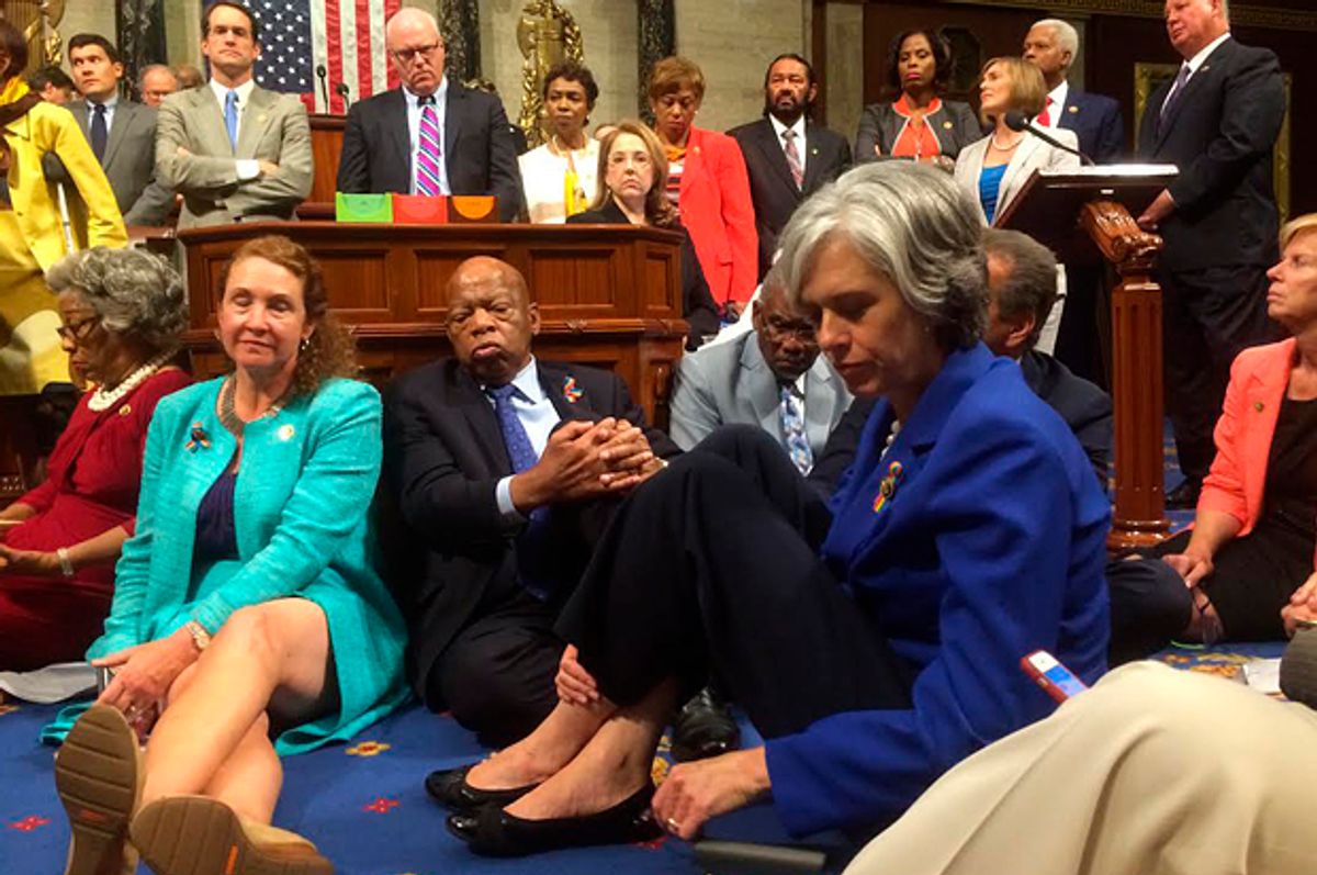 A photo shot and tweeted from the floor of the U.S. House of Representatives by U.S. House Rep. Katherine Clark shows Democratic members of the House staging a sit-in on the House floor "to demand action on common sense gun legislation," June 22, 2016.   (Reuters/U.S. Rep. Katherine Clark)