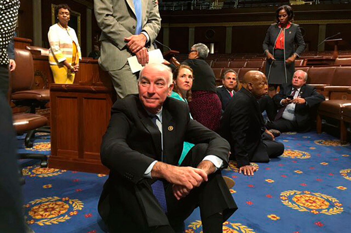 A photo shot and tweeted from the floor by U.S. Rep. John Yarmuth shows Democratic members of the House staging a sit-in "to demand action on common sense gun legislation," June 22, 2016.   (Reuters/U.S. Rep. John Yarmuth)