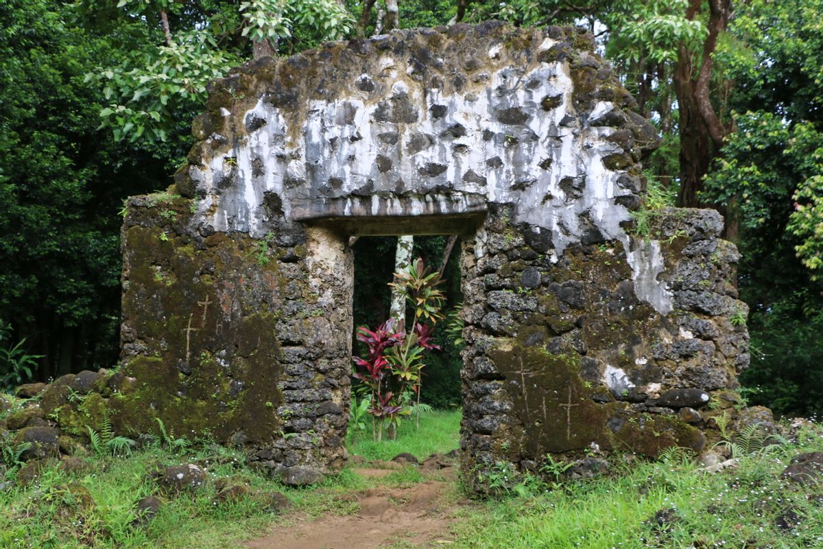 This undated photo, provided by the Hawaii Department of Land and Natural Resources, shows the crumbling remains of the 180-year-old summer palace of former King Kamehameha III where vandals etched crosses in the forest of a Honolulu, Hawaii, neighborhood. The Department said Thursday, June 23, 2016, that unless the vandals are caught desecrating the sacred cultural site, there's little law enforcement officers can do.(Hawaii Department of Land and Natural Resources via AP)  (Hawaii Department of Land and Natural Resources via AP)