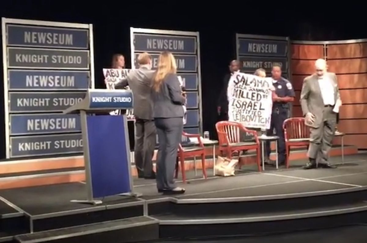 CODEPINK protesting at the Newseum event (YouTube)
