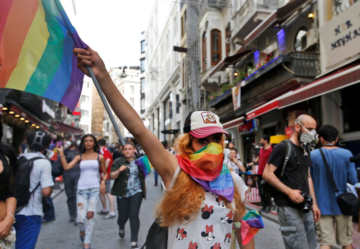 People protests against the ban on a gay pride march, off Istiklal Avenue, central Istanbul's main shopping road, Sunday, June 19, 2016. Turkish police fired tear gas and rubber bullets to disperse demonstrators who gathered for a gay pride rally in Istanbul despite a government ban. stanbul's governor had banned gay, lesbian and transgender individuals from holding two annual parades this year citing security concerns. (AP Photo/ Emrah Gurel) (AP)