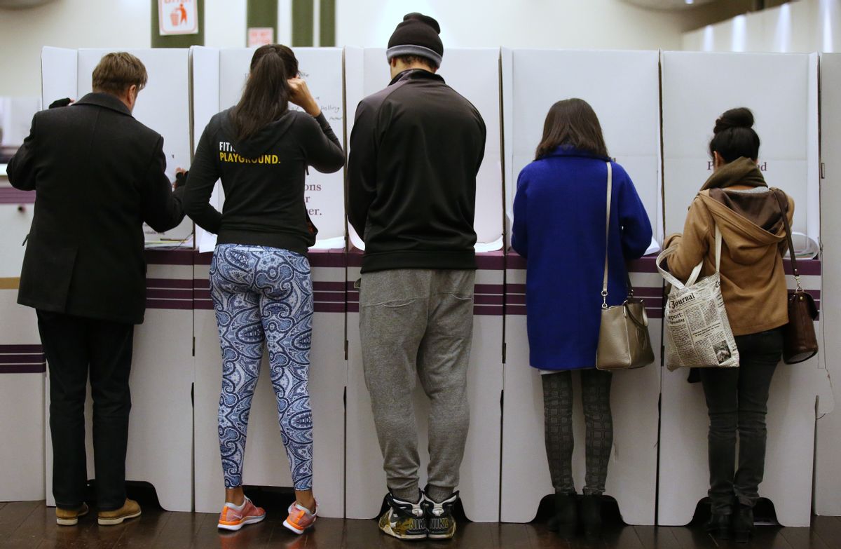 Voters fill in their ballots at a polling station at Town Hall in Sydney, Saturday, July 2, 2016. After years of political turmoil, Australians head to the polls with leaders of the nation's major parties each promising to bring stability to a government that has long been mired in chaos. (AP Photo/Rick Rycroft) (AP)