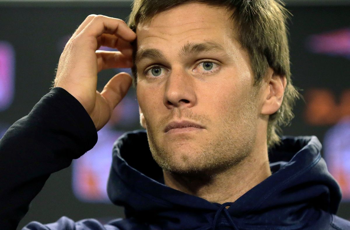FILE - In this Jan. 6, 2016 file photo, New England Patriots quarterback Tom Brady faces reporters before a scheduled NFL football practice in Foxborough, Mass. On Wednesday, July 13, 2016, a federal appeals court has rejected Tom Brady's attempt to get a new hearing on his suspension. Brady was asking for the full 2nd U.S. Circuit Court of Appeals to hear the case. In April, a three-judge panel said that NFL commissioner Roger Goodell was within his powers when he suspended the star quarterback four games for his role in a scheme to doctor the footballs used in a Jan. 18, 2015, playoff game. (AP Photo/Steven Senne, File) (AP Photo/Steven Senne, File)
