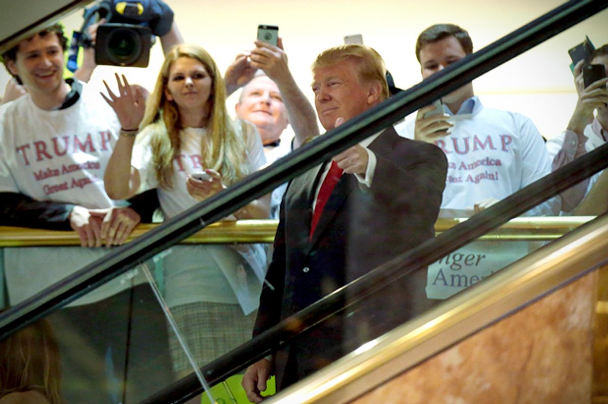 Donald Trump arrives by escalator inside Trump Tower to announce his campaign for the 2016 Republican presidential nomination in New York, June 16, 2015.  (Reuters/Brendan McDermid)