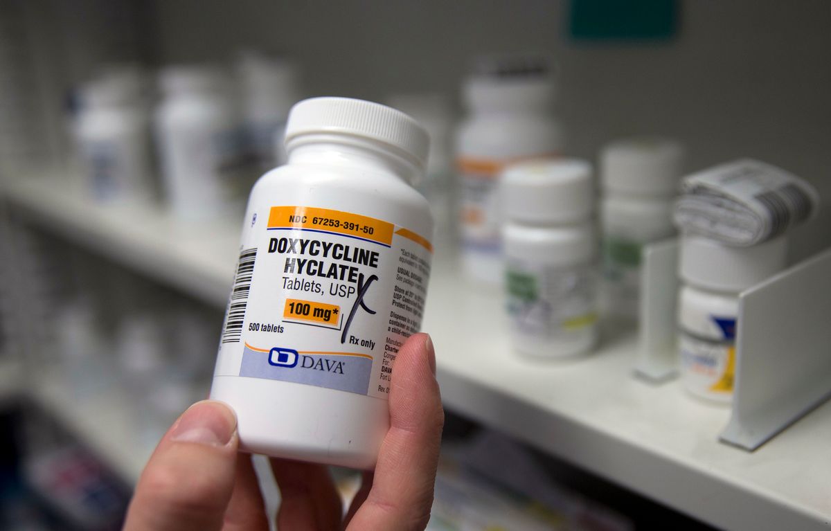 In this Friday, July 8, 2016, photo, pharmacist Clint Hopkins, owner of Pucci's Pharmacy, displays a bottle of the antibiotic doxycycline hyclate, in Sacramento, Calif. The drug is one of several that has seen a significant cost increase in recent months. In an effort to discourage drugmakers from raising their prices too quickly or introducing new medications that are unaffordable to the average person, state Sen. Ed Hernandez, D-Azusa, has introduced legislation that would require drugmakers to provide advance notice before making big price increases. (AP Photo/Rich Pedroncelli) (AP)