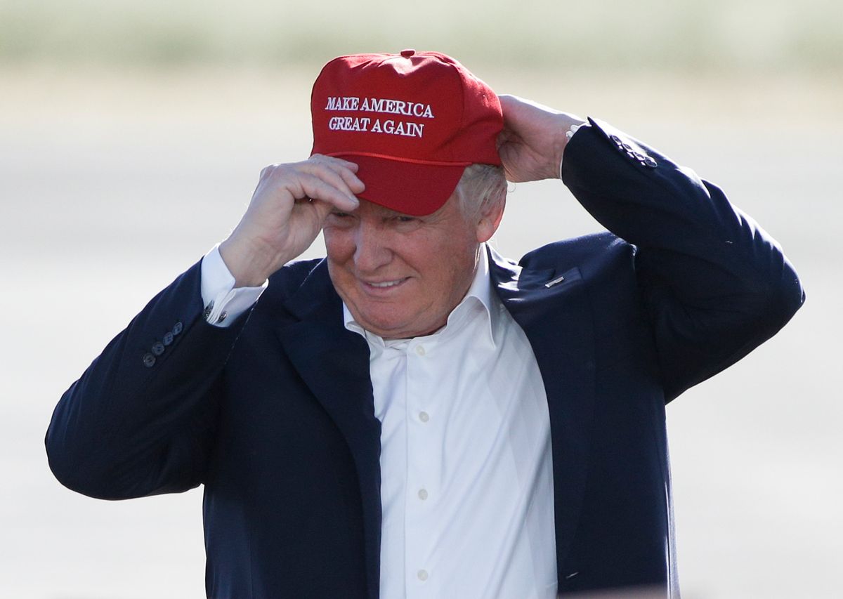 FILE - In this June 1, 2016, file photo, Republican presidential candidate Donald Trump wears his "Make America Great Again" hat at a rally in Sacramento, Calif. Trump’s “Make America Great Again” hats proudly tout they are “Made in USA.” Not necessarily always the case, an Associated Press review found. (AP Photo/Jae C. Hong, File)