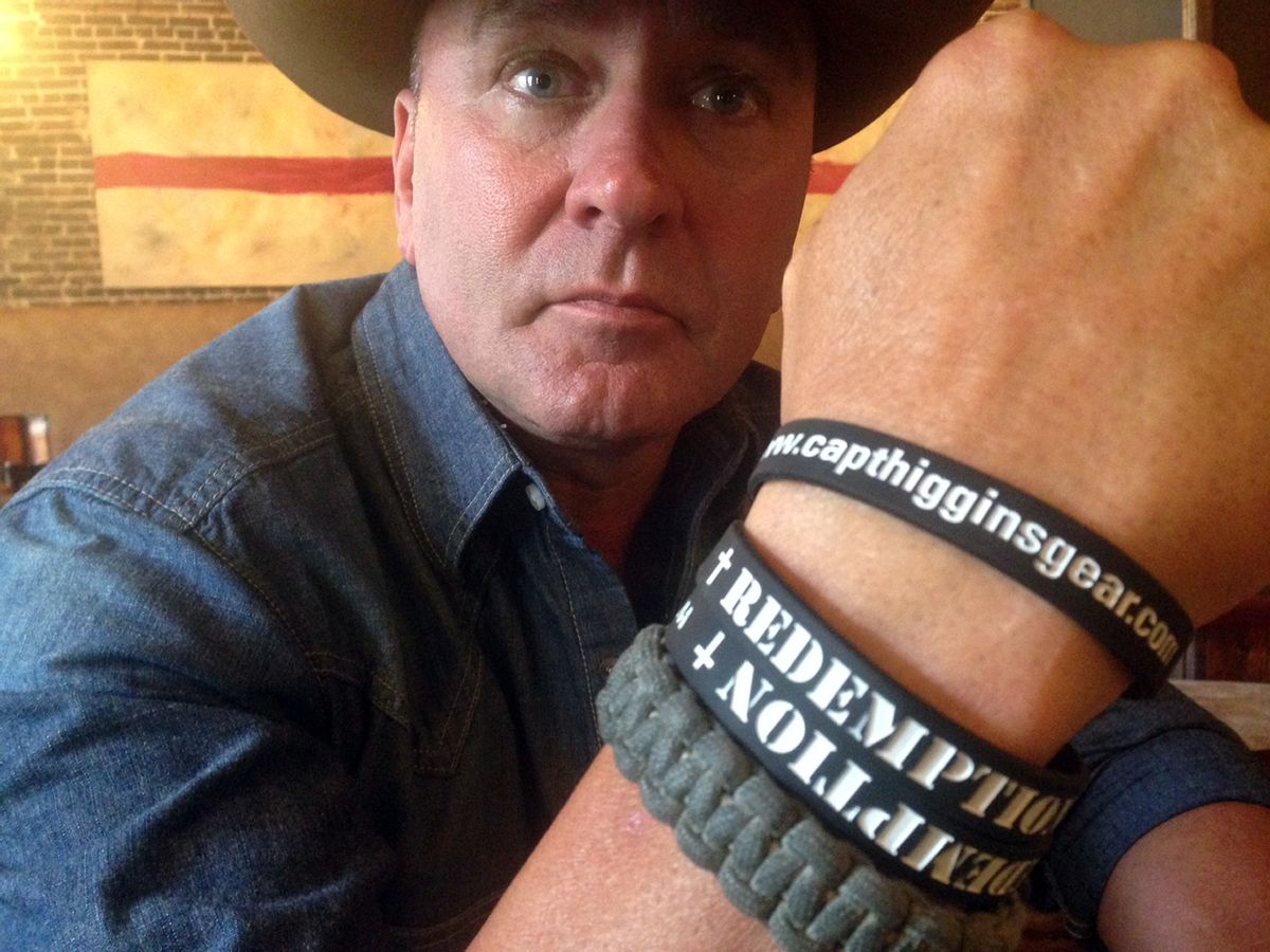 In this June 2, 2016, photo, Clay Higgins, a former Captain for the St. Landry Parish Sheriff's office, and candidate for Congress, poses for a photograph in Lafayette, La. His wristband is printed with the word "redemption." The man dubbed the “Cajun John Wayne” has set his sights on a congressional seat. Higgins, a Republican, is one of seven candidates vying for the seat in Louisiana’s southwestern district, which is being vacated by Republican Rep. Charles Boustany, who is running for Senate. (AP Photo/Kevin McGill) (AP)