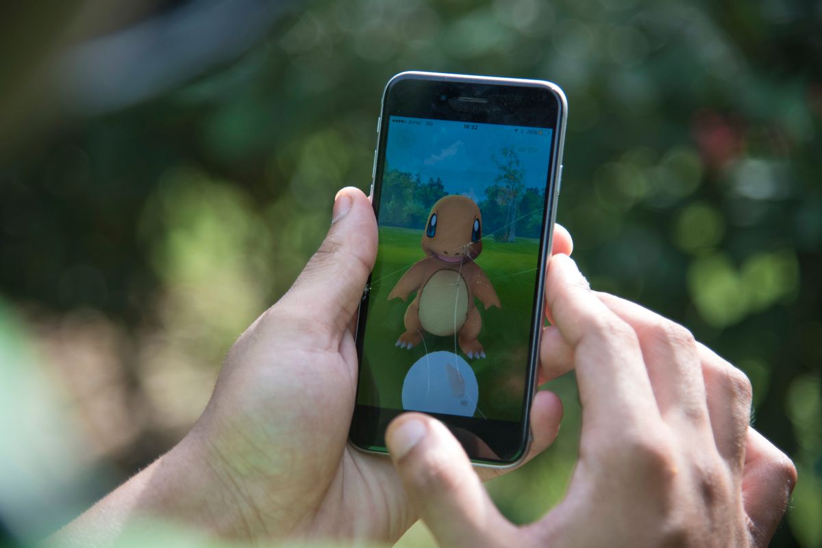 In this Friday, July 22, 2016 photo, a Pokemon Go player attempts to catch Charmander, one of Pokemon's most iconic creature, in New Delhi, India.  (AP Photo/Thomas Cytrynowicz) (AP)