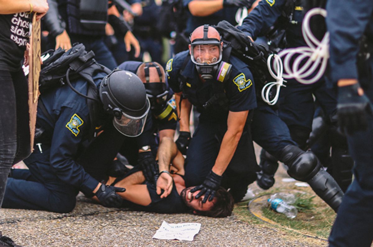 
On Sunday July 10th, Baton Rouge Police violently arrest protester Max Geller. (Patrick Melon; @melontao)