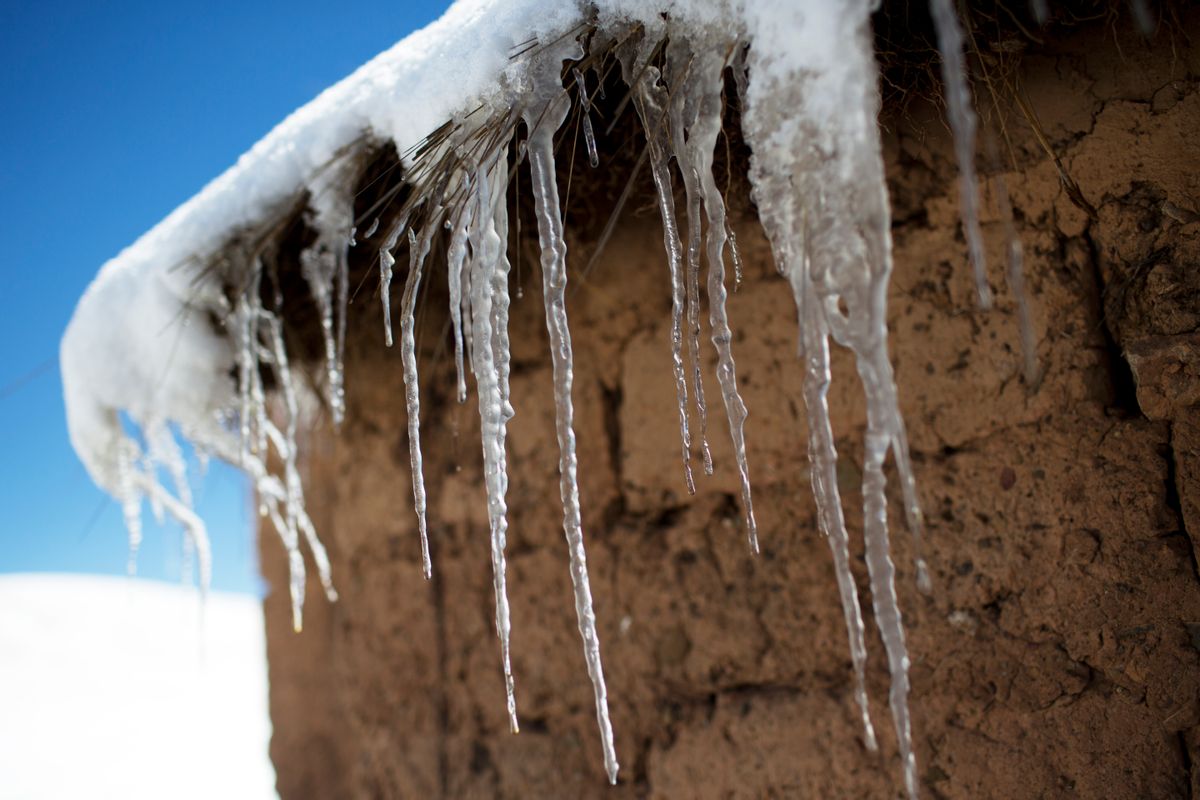 In this July 8, 2016 photo, icicles hang from the roof of an adobe home in San Antonio de Putina in the Puno region of Peru, where farmers raise alpacas and sheep for their wool. Every winter freeze destroys the tough grasslands the animals feed on and almost no crops can survive in the nutrient-poor soil. (AP Photo/Rodrigo Abd) (AP)
