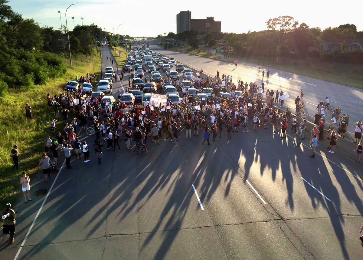 FILE - In this July 9, 2016 file photo, marchers block part of Interstate 94 in St. Paul, Minn., during a protest sparked by the recent police killings of black men in Minnesota and Louisiana. The killing of Philando Castile by a Minnesota police officer during a traffic stop last week tore open wounds that hadn't yet healed in Minnesota's black community from a previous officer-involved death last year. (Glen Stubbe/Star Tribune via AP, File) (AP)