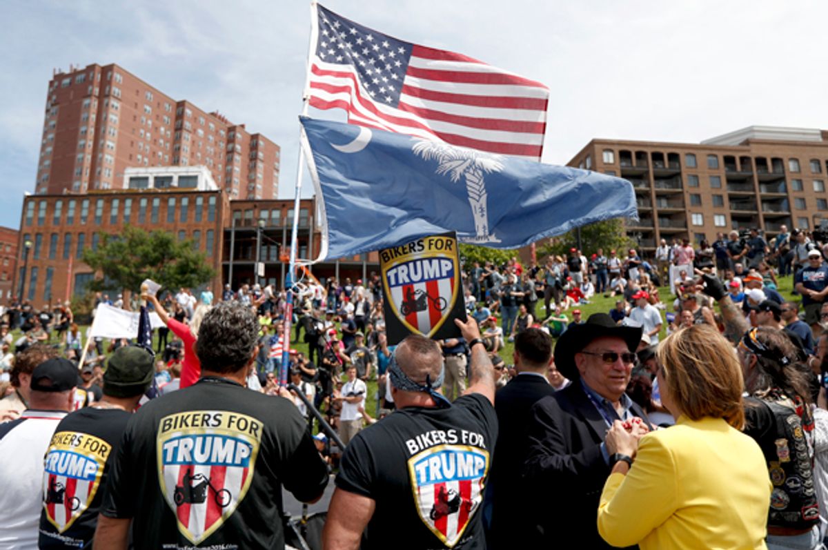 Members of the group Bikers for Trump watch during a rally for Donald Trump at Settlers Landing Park, July 18, 2016, in Cleveland.   (AP/John Minchillo)