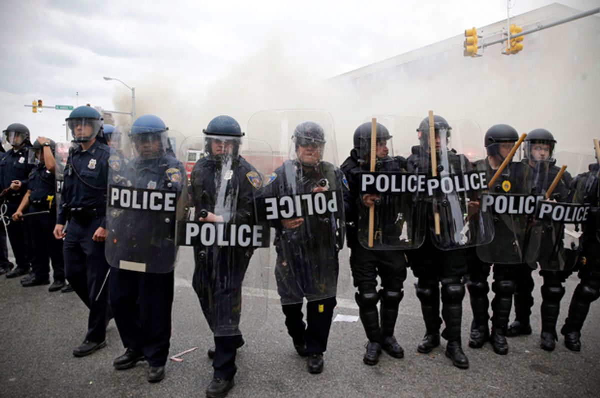 Police advance toward protestors during unrest following the funeral of Freddie Gray in Baltimore, April 27, 2015.   (AP/Patrick Semansky)