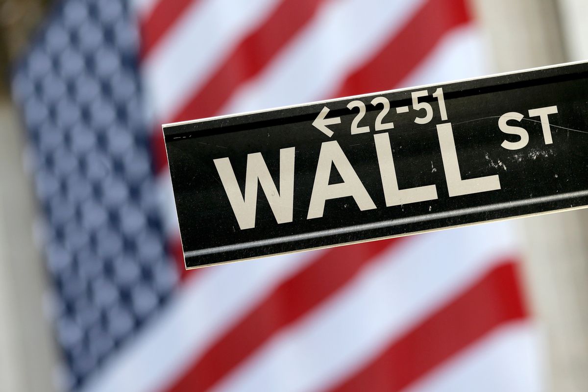 FILE - In this Tuesday, Sept. 8, 2015, file photo, a Wall Street street sign is framed by an American flag hanging on the facade of the New York Stock Exchange. Global stock markets rose Tuesday, Aug. 9, 2016, as slack Chinese consumer price figures stoked expectations of more stimulus policies. Oil prices rose further after reports of a new OPEC meeting. (AP Photo/Mary Altaffer, File) (AP)