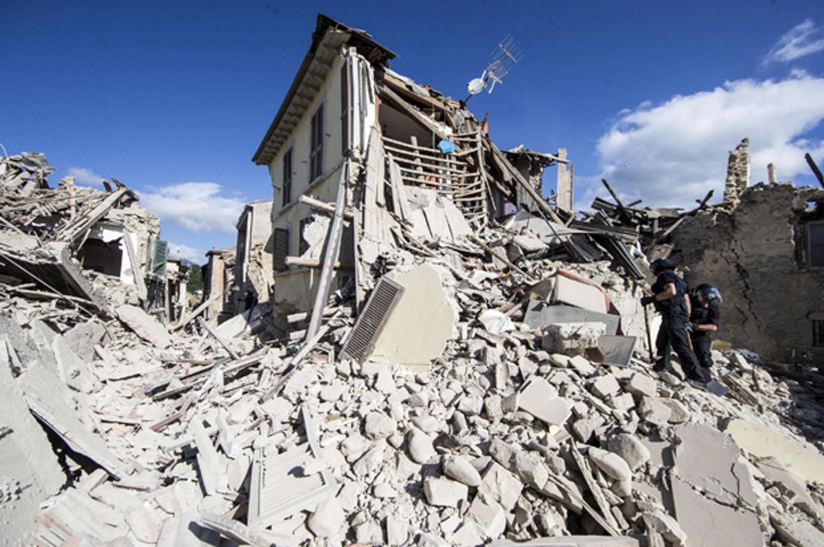 Rescuers search for survivors under the rubble of the town of Amatrice, central Italy following an earthquake, August 24, 2016.   (AP/Massimo Percossi)