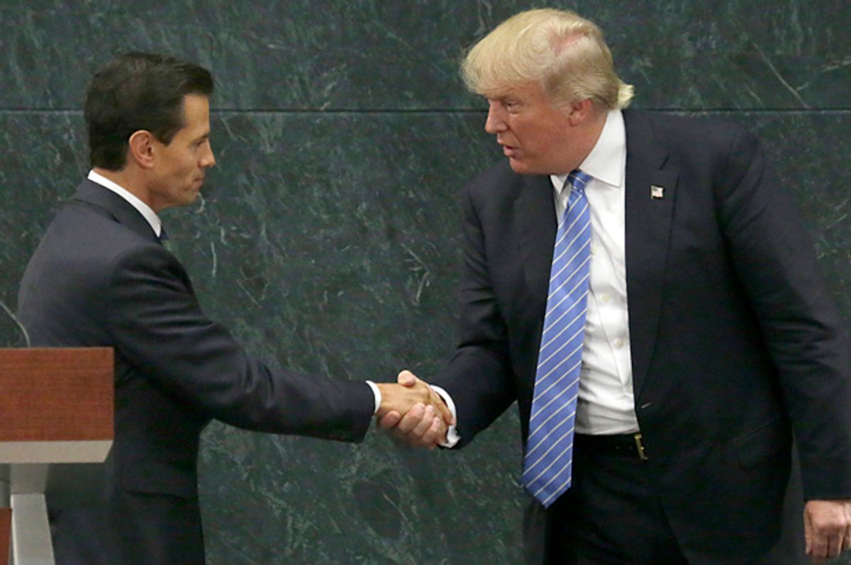 Mexico President Enrique Pena Nieto and Donald Trump shake hands after a joint statement in Mexico City, Aug. 31, 2016.   (AP/Marco Ugarte)
