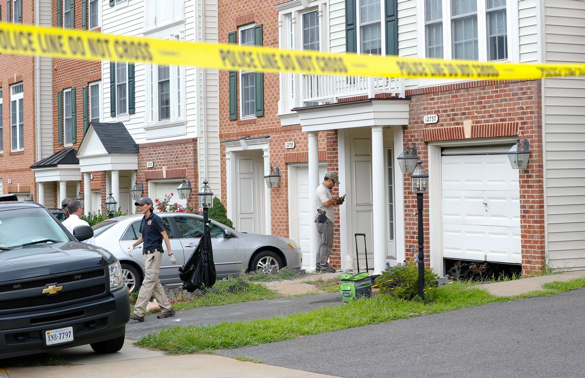 Law enforcement officers are seen outside the home of Nicholas Young, a Washington Metro Transit Officer, Wednesday, Aug. 3, 2016, in Fairfax, Va., Young was arrested at Metro's headquarters in Washington and charged with a single count of attempting to provided material support to a terrorist group. (AP Photo/Pablo Martinez Monsivais) (AP)