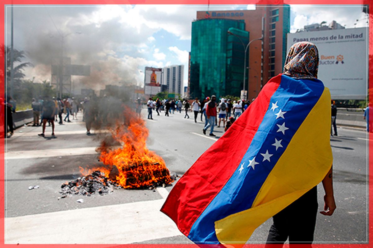 Protesters clash with riot police during a rally to demand a referendum to remove Venezuela's President Nicolas Maduro in Caracas, Venezuela, September 1, 2016.  REUTERS/Carlos Garcia Rawlins     TPX IMAGES OF THE DAY      - RTX2NTR7 (Reuters)