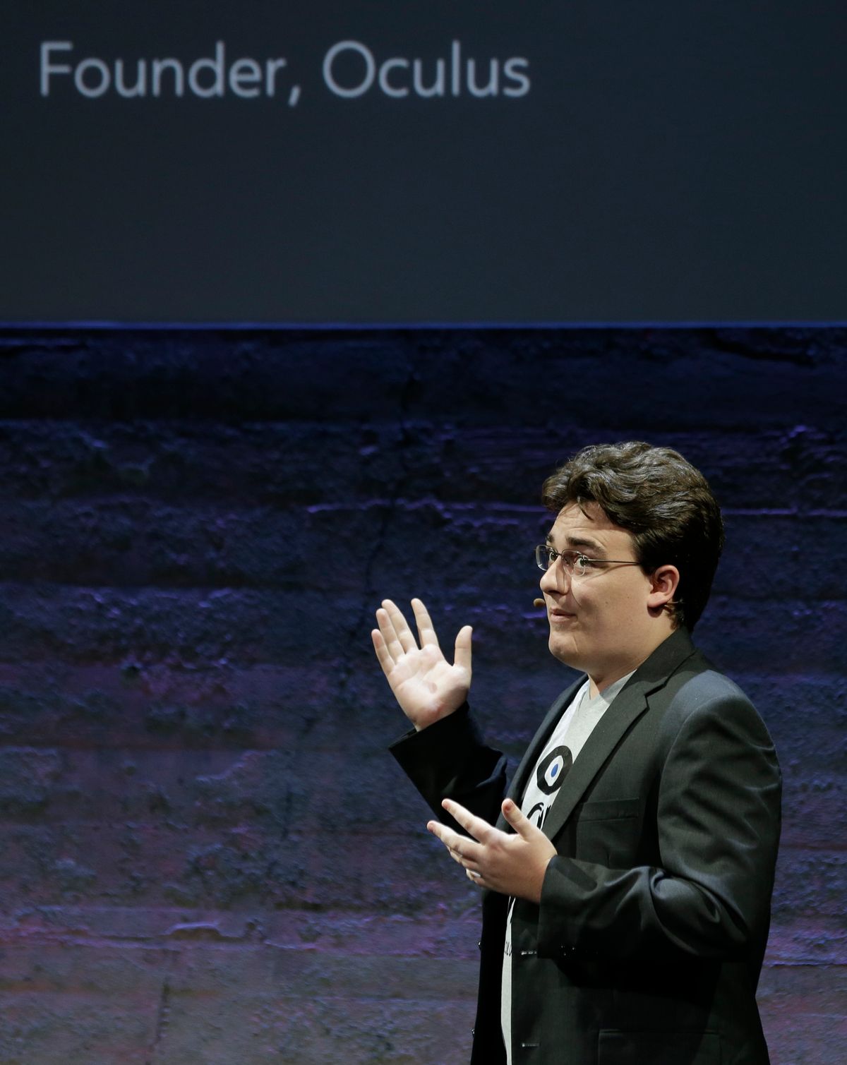 Oculus Founder Palmer Luckey talks about the Rift virtual-reality headset during a news conference Thursday, June 11, 2015, in San Francisco. Oculus is expanding its highly anticipated virtual-reality headset to simulate the sensation of touch and gesturing as part of its quest to blur the lines between the fake and genuine world. (AP Photo/Eric Risberg) (Associated Press)