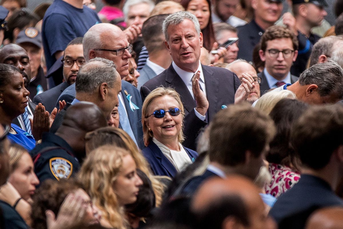 Democratic presidential candidate Hillary Clinton, center, accompanied by Sen. Chuck Schumer, D-N.Y., center left, Rep. Joseph Crowley, D-N.Y., second from left, and New York Mayor Bill de Blasio, center top, attends a ceremony at the Sept. 11 memorial, in New York. (AP)