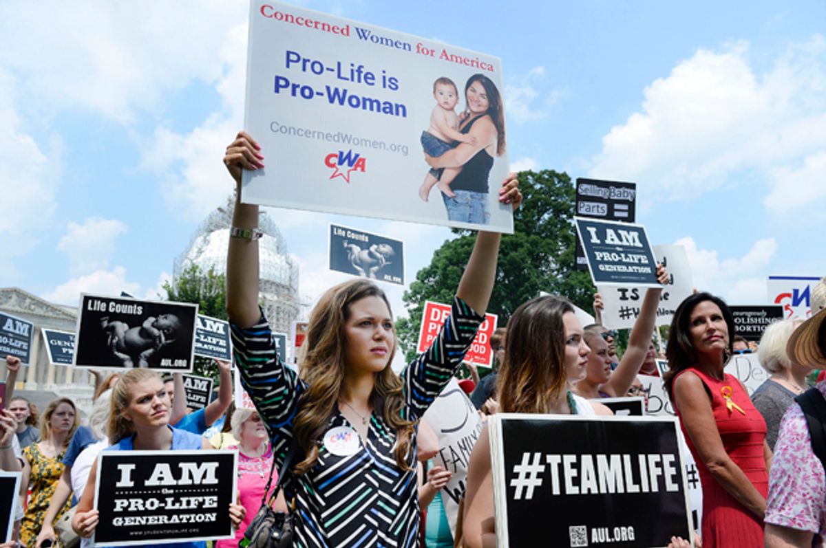 Anti-abortion activists protest federal funding for Planned Parenthood in front of the U.S. Capitol, July 28, 2015.    (Getty/Olivier Douliery)