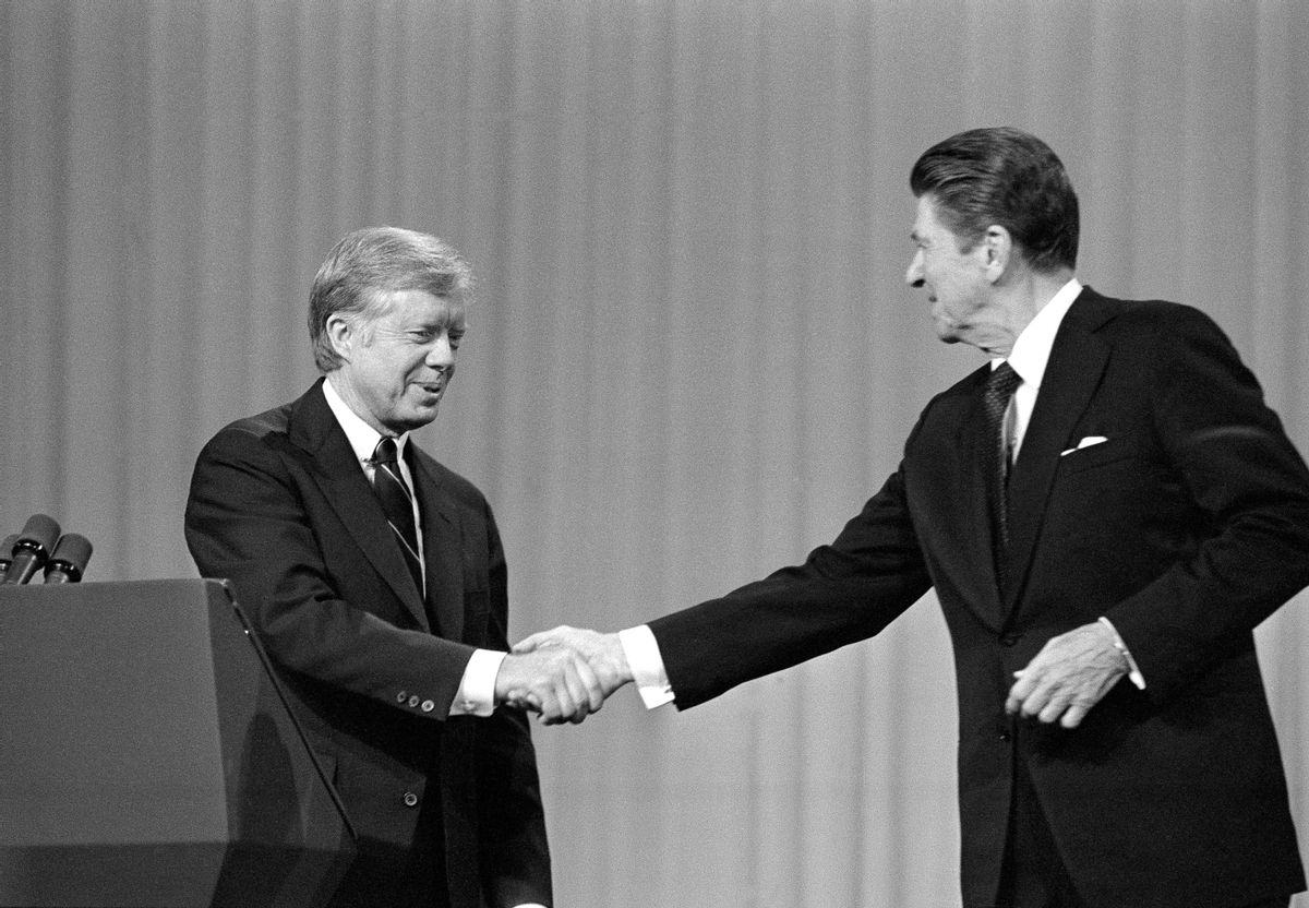 ADVANCE FOR MONDAY, SEPT. 5 AND THEREAFTER -FILE - In this Oct. 28, 1980 file photo, President Jimmy Carter shakes hands with Republican Presidential candidate Ronald Reagan after debating in the Cleveland Music Hall in Cleveland.  (AP)