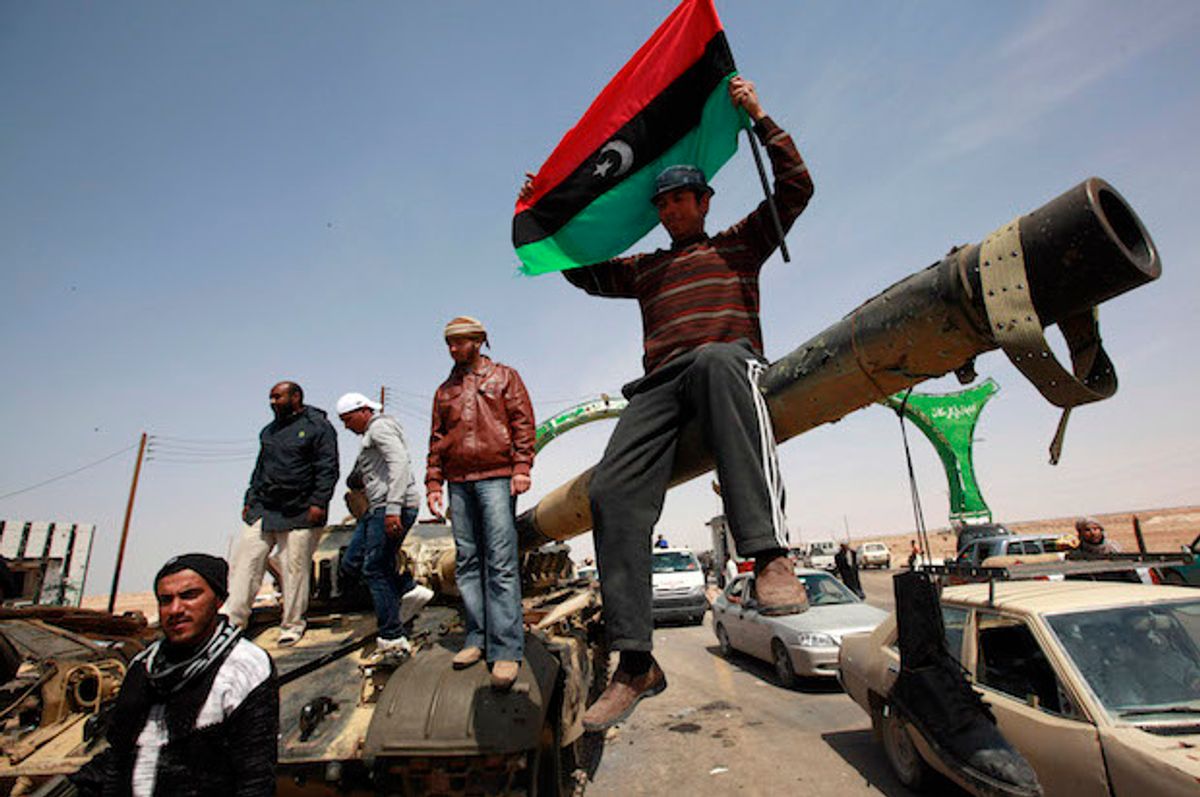 Libyan rebels on a tank outside the town of Ajdabiyah on March 26, 2011  (Reuters/Andrew Winning)