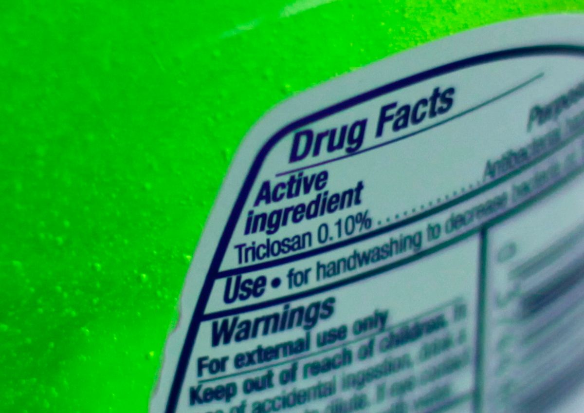FILE - This Tuesday, April 30, 2013 file photo shows the label of a bottle of antibacterial soap in a kitchen in Chicago. The U.S. government is banning more than a dozen chemicals, including triclosan, long-used in antibacterial soaps and washes, saying manufacturers have failed to show that they are safe and prevent the spread of germs. (AP Photo/Kiichiro Sato) (AP)