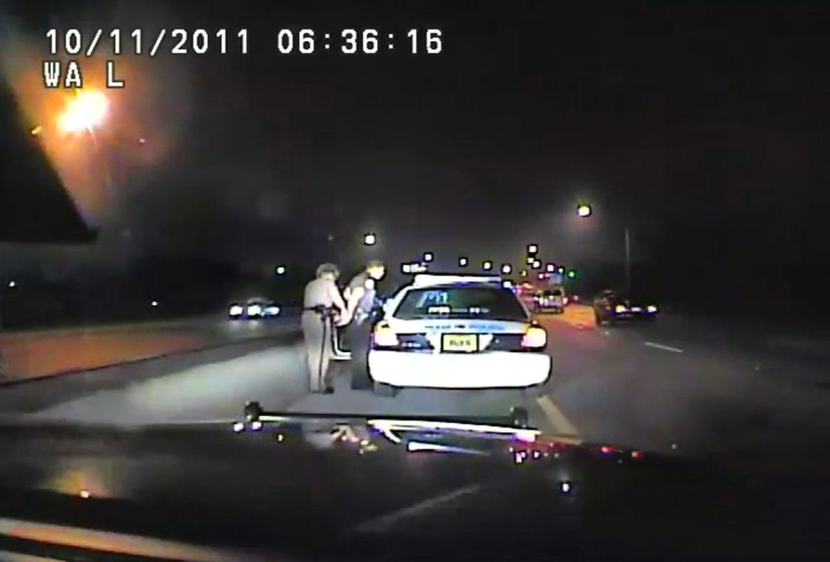 In this image made from an Oct. 11, 2011 video made available by the Florida Department of Highway Safety and Motor Vehicles, Florida Highway Patrol Officer Donna Watts arrests Miami Police Department Officer Fausto Lopez who was traveling at 120 miles per hour to an off-duty job, in Hollywood, Fla. After the incident, Watts says that she was harassed with prank calls, threatening posts on law enforcement message boards and unfamiliar cars that idled near her home. In lawsuits, she accused dozens of officers of obtaining information about her in the state’s driver database. (Florida Department of Highway Safety and Motor Vehicles via AP) (AP)