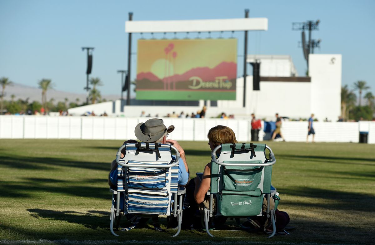 Festivalgoers rest in lawn chairs as they wait for performances to begin on day 2 of the 2016 Desert Trip music festival at Empire Polo Field on Saturday, Oct. 8, 2016, in Indio, Calif. (Photo by Chris Pizzello/Invision/AP) (Chris Pizzello/invision/ap)