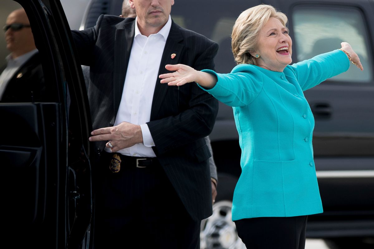 Democratic presidential candidate Hillary Clinton reacts to a reporters questions about her birthday before boarding her campaign plane at Miami International Airport in Miami, Wednesday, Oct. 26, 2016, to travel to Lake Worth, Fla. for a rally. Clinton turns 69 today. (AP Photo/Andrew Harnik) (AP Photo/Andrew Harnik)