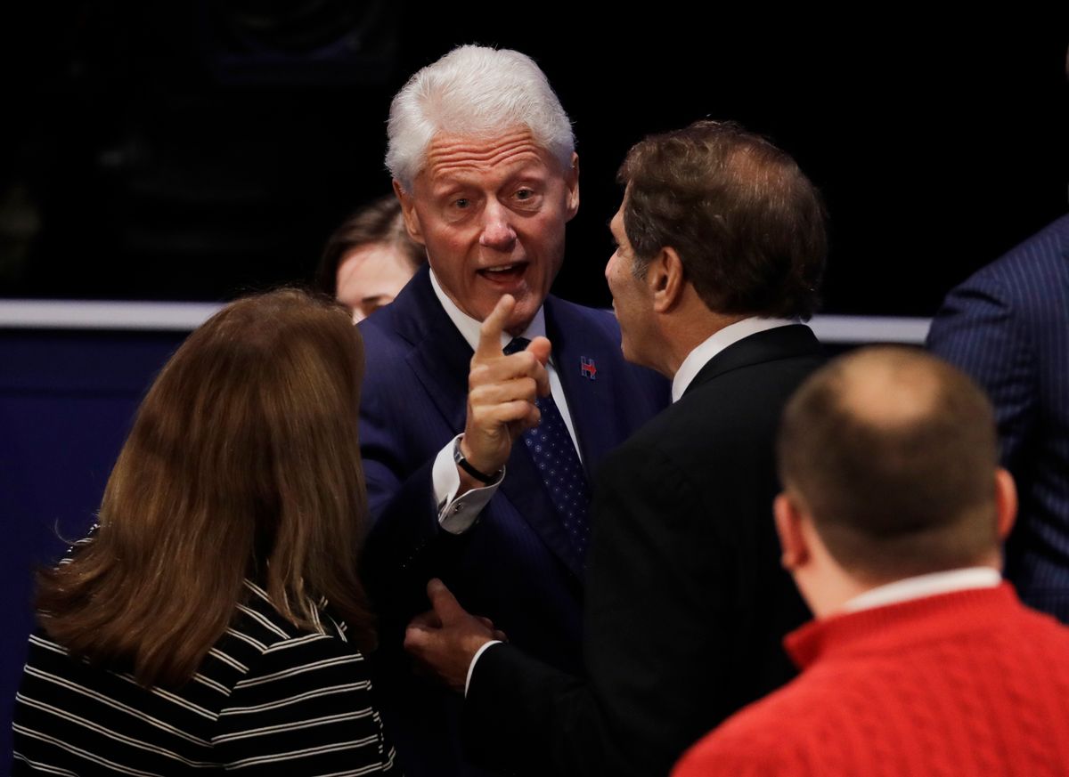 Bill Clinton speaks to a town hall participant following during the second presidential debate between Republican presidential nominee Donald Trump and Democratic presidential nominee Hillary Clinton at Washington University in St. Louis, Sunday, Oct. 9, 2016. (AP Photo/Patrick Semansky) (AP)