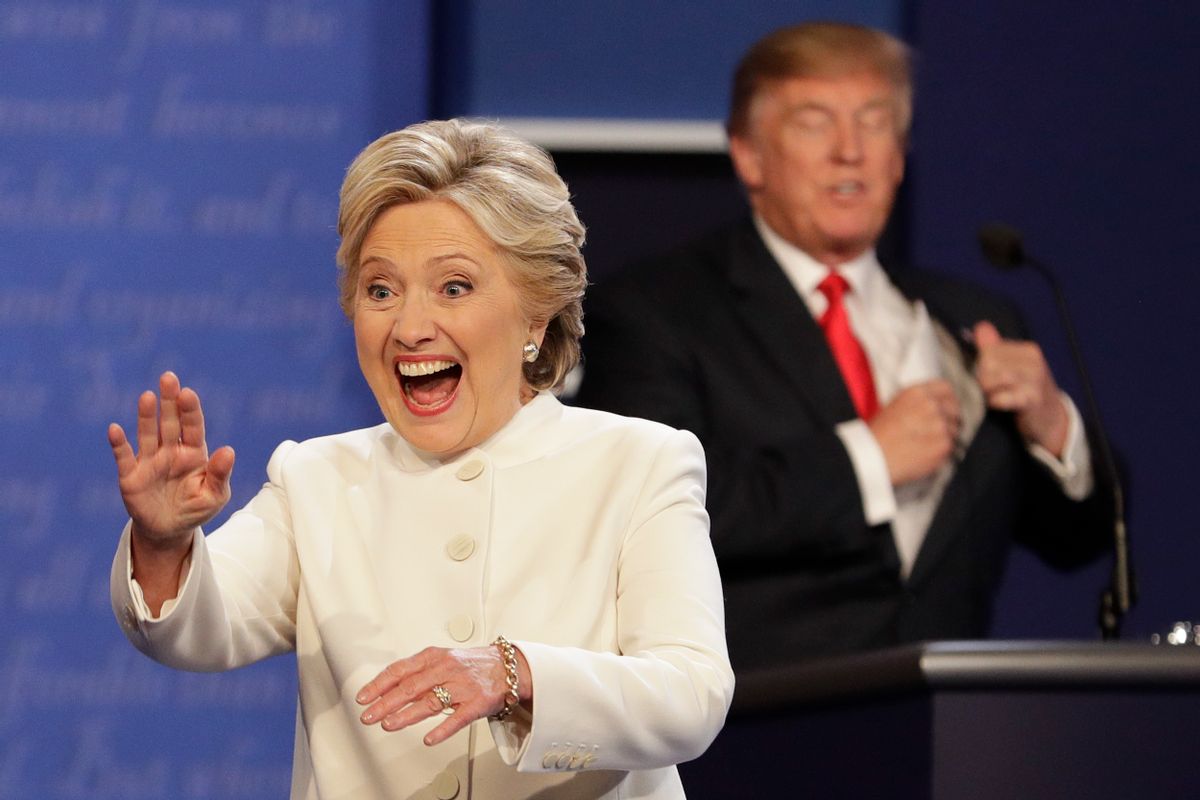 Democratic presidential nominee Hillary Clinton waves to the audience as Republican presidential nominee Donald Trump puts his notes away after the third presidential debate at UNLV in Las Vegas. (AP)
