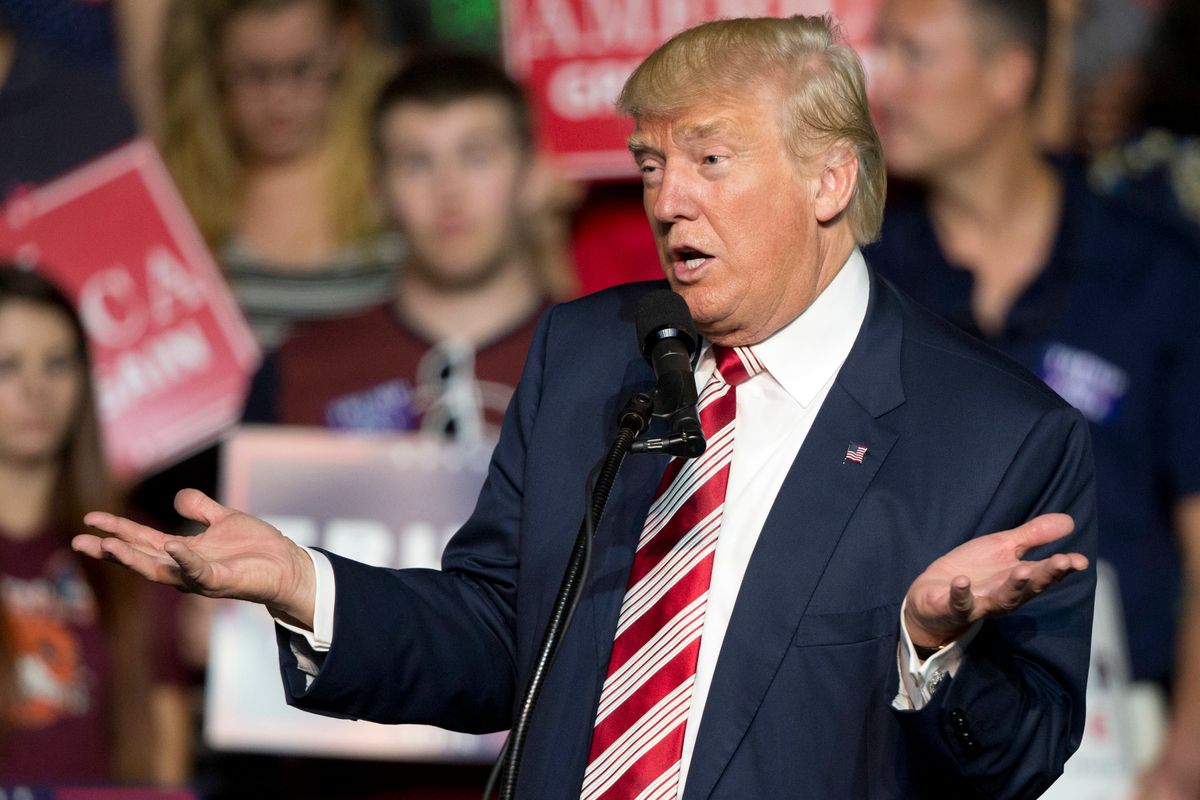 FILE – In this Sept. 24, 2016, file photo, Republican presidential candidate Donald Trump gestures during a rally in Roanoke, Va. Countless former Democrats in Ohio's blue-collar Mahoning Valley are transferring their adoration for late U.S. Rep. James A. Traficant Jr., D-Ohio, to Trump, while those who knew Traficant say similarities between him and Trump end at the populist bravado and outsized hair. (AP Photo/Steve Helber, File) (AP Photo/Steve Helber, File)