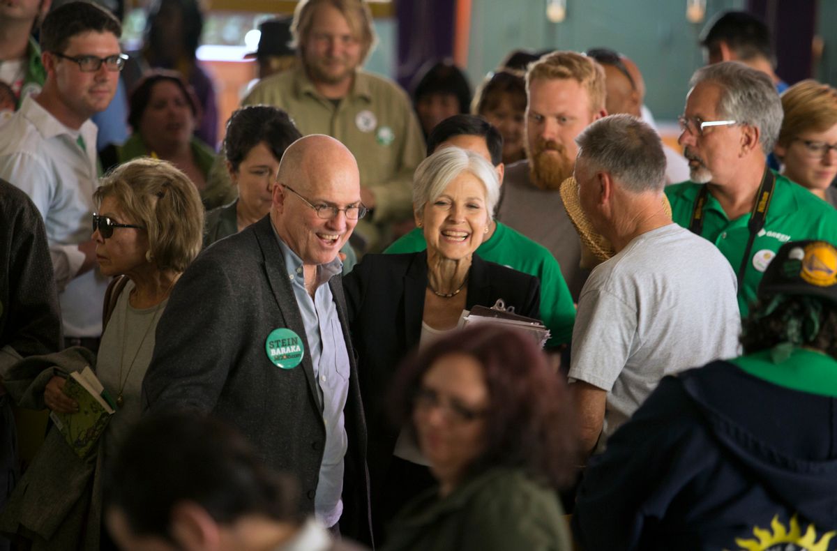 Accompanied by 2004 presidential candidate David Cobb, left, Green party presidential hopeful Jill Stein meets her supporters during a campaign stop at Humanist Hall in Oakland, Calif.  (AP)