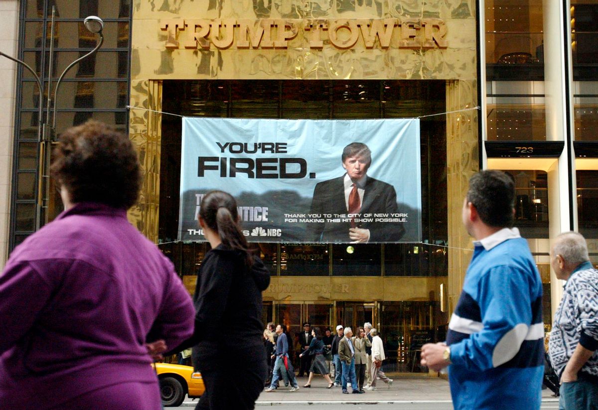 FILE - In this Saturday, March 27, 2004 file photo, passersby look at a sign advertising the reality television show, "The Apprentice," displayed at the entrance to the Trump Tower building in New York. Donald Trump's development firm was issued summonses by the city because it did not have the proper permits for the giant banner. In his years on the show, Trump repeatedly demeaned women with sexist language, according to show insiders who said he rated female contestants by the size of their breasts and talked about which ones he'd like to have sex with. (AP Photo/Bebeto Matthews) (AP)