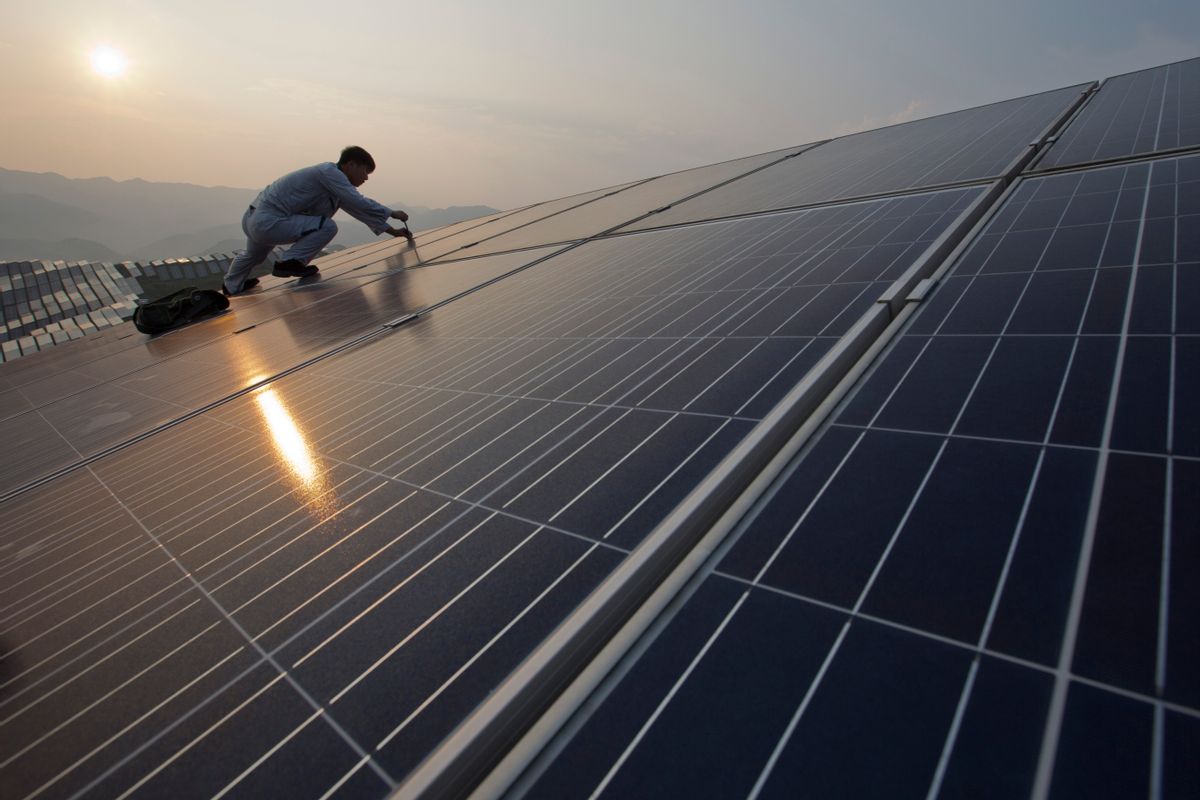 In this Aug. 21, 2016 photo, a worker performs maintenance work on solar panels at a photovoltaic power station in Songxi county in southeast China's Fujian province. Solar panels are among a series of industries from steel and cement to wind turbines in which Chinese production capacity soared during the past decade's economic boom until it vastly exceeded demand. (Chinatopix via AP) (AP)