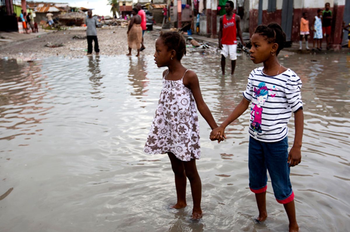 Flooded street after the passing of Hurricane Matthew in Les Cayes, Haiti   (AP/Dieu Nalio Chery)