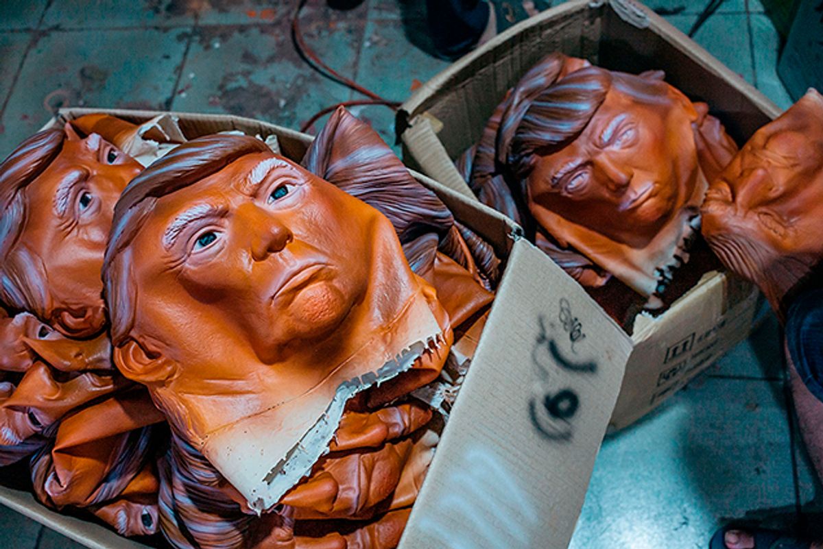 Masks of Donald Trump are seen in boxes at the Shenzhen Lanbingcai Latex Crafts Factory on October 18, 2016 in Shenzhen, China.  (Getty Images)