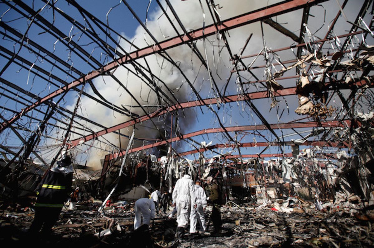 Forensic experts investigate the ruins of a community hall after it  was bombed by Saudi-led warplanes in Sanaa, the capital of Yemen, Oct. 9, 2016  (Reuters/Khaled Abdullah)