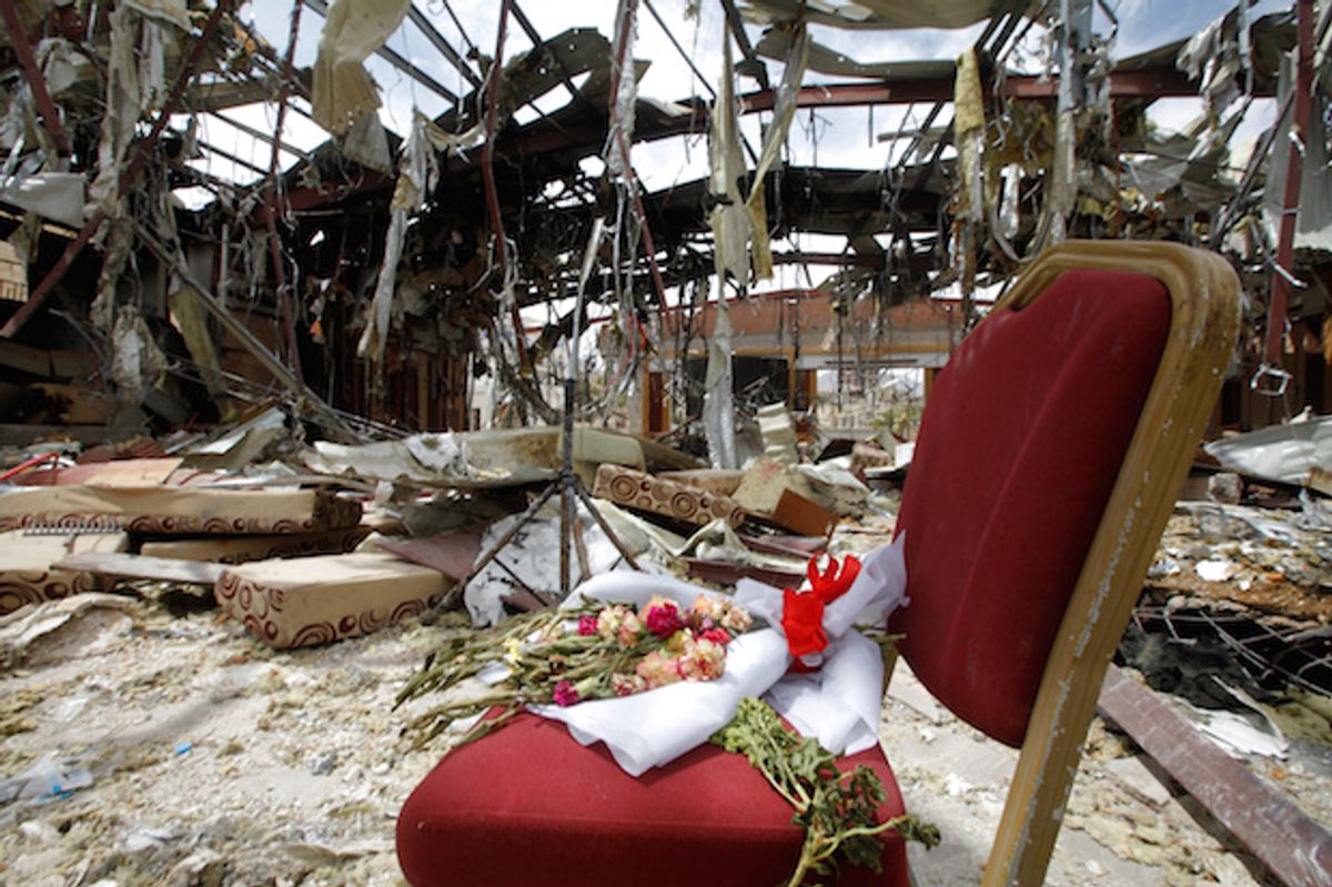 Flowers on a chair in the ruins of a community hall that the U.S.-backed, Saudi-led coalition bombed during a funeral on October 8, in Sanaa, Yemen, October 16, 2016  (Reuters/Mohamed al-Sayaghi)