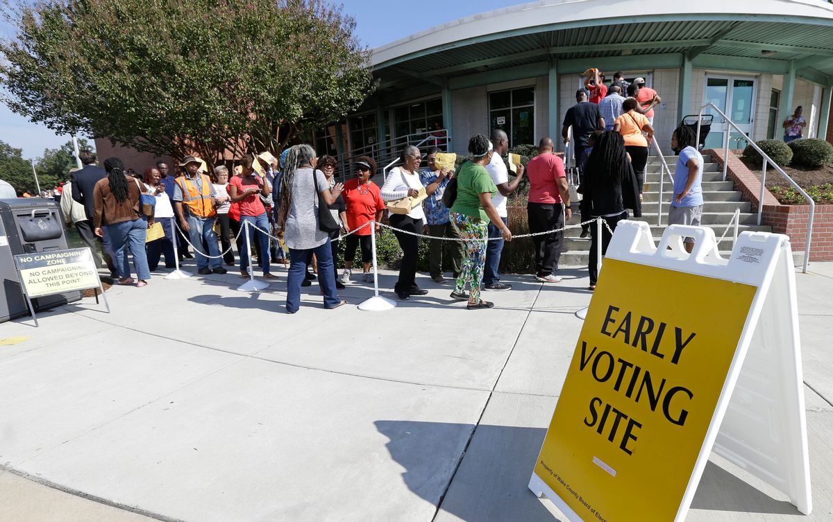 FILE - In this Oct. 20, 2016 file photo , voters line up during early voting in Raleigh, N.C. Fourteen states had new voting or registration restrictions in place for the 2016 presidential election, raising concerns that minority voters in particular would have a harder time accessing the ballot box. (AP)