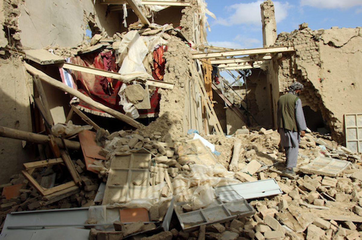 An Afghan man inspects a house destroyed during Thursday’s clashes between Afghan security forces and Taliban in Kunduz, Afghanistan, on November 4, 2016  (Reuters/Nasir Wakif)