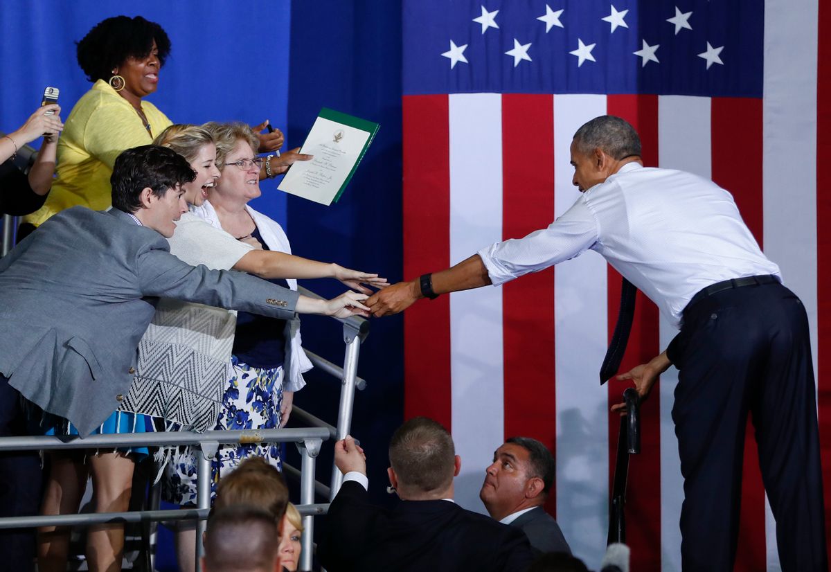 President Barack Obama reaches out to greet a group of women supporters after speaking at the University of North Florida in Jacksonville, Fla., Thursday, Nov. 3, 2016, during a campaign rally for Democratic presidential candidate Hillary Clinton. (AP Photo/Pablo Martinez Monsivais) (AP)